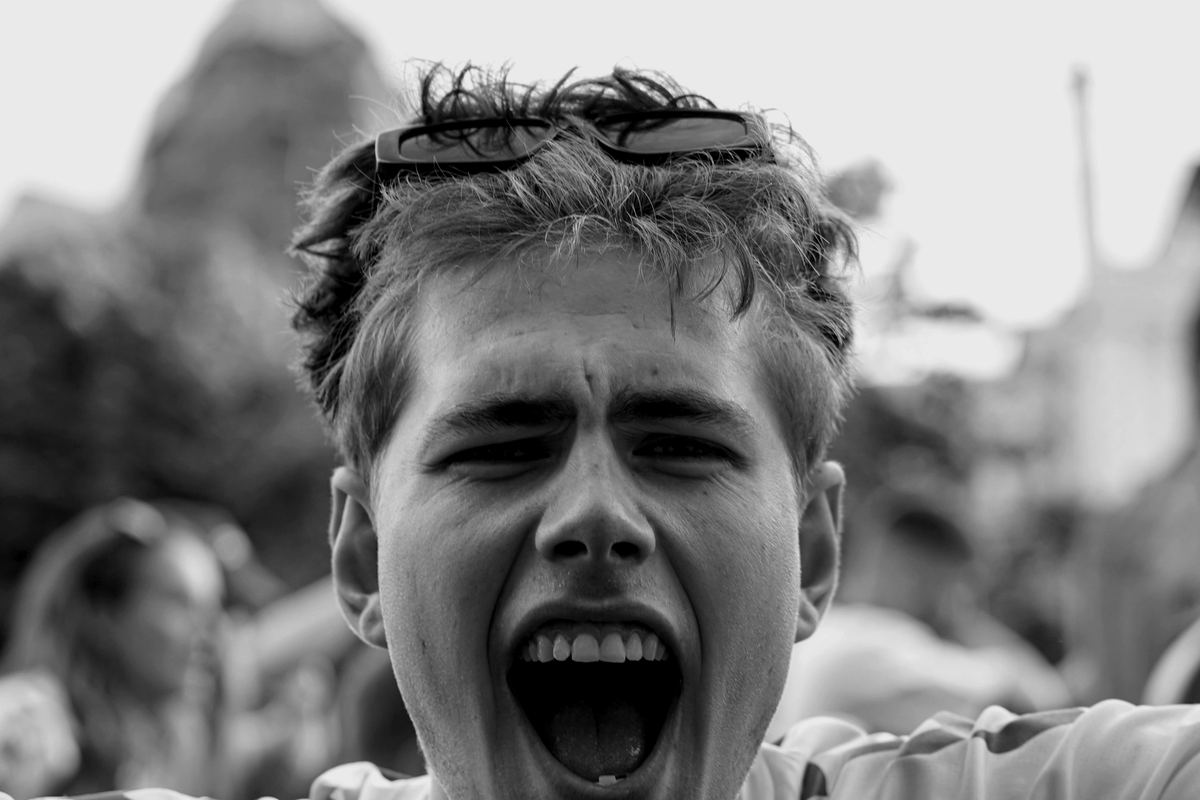 A young fan shouting with joy in the crowd